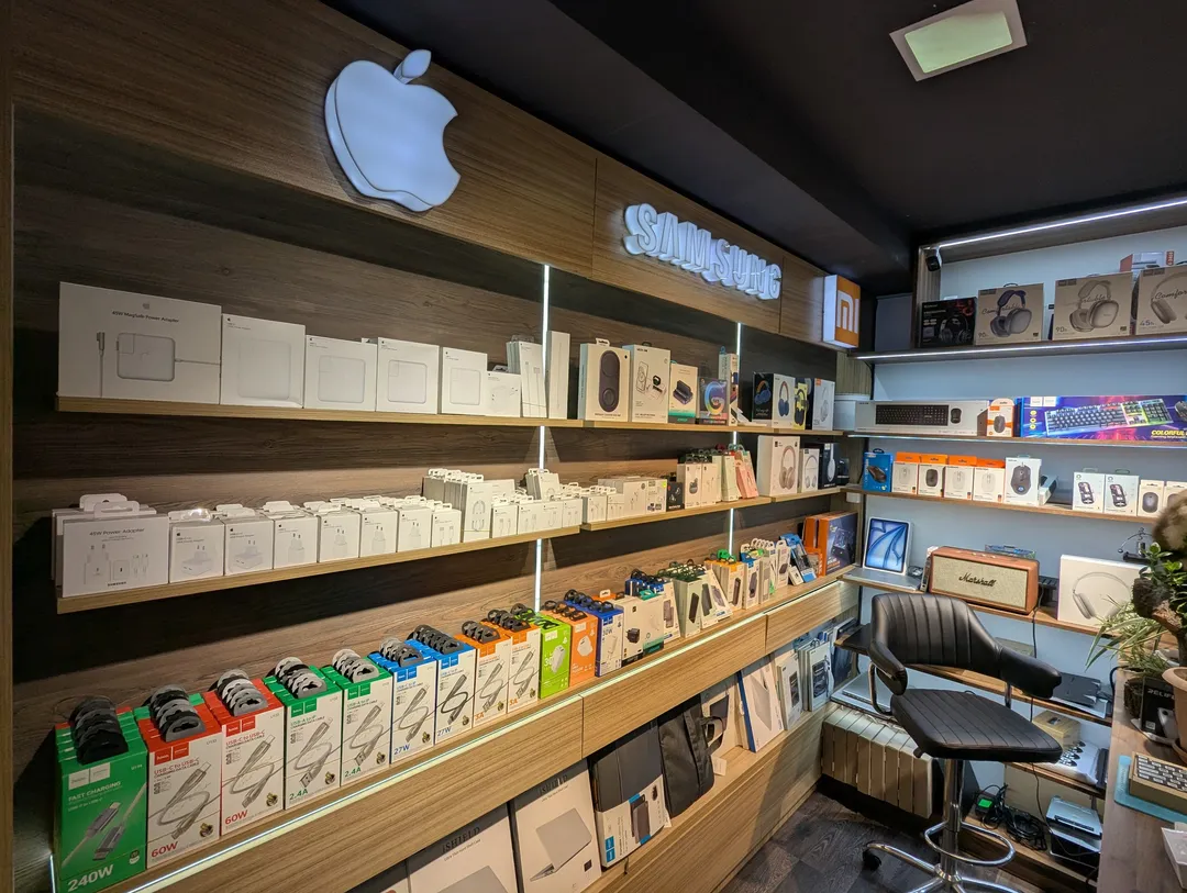 Shelves at XFix with chargers, cables, headphones, keyboards, mice and laptop bags