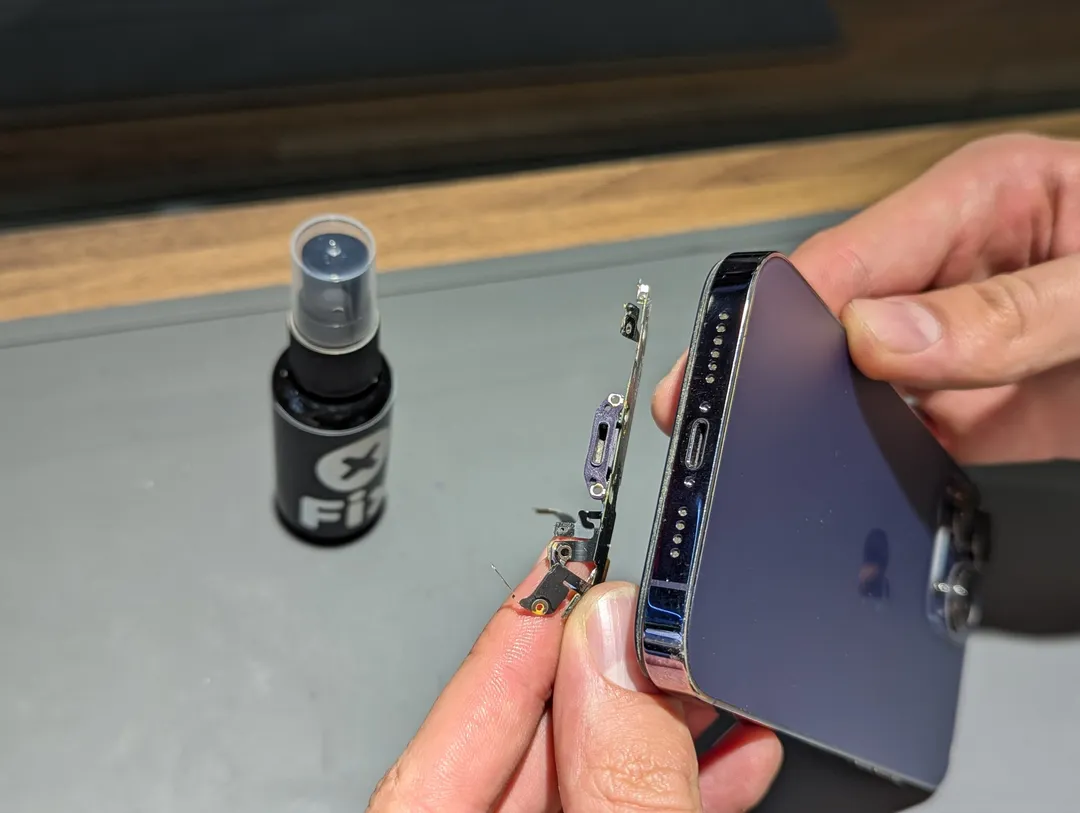 Removing the charging port flex from an iPhone 14 Pro